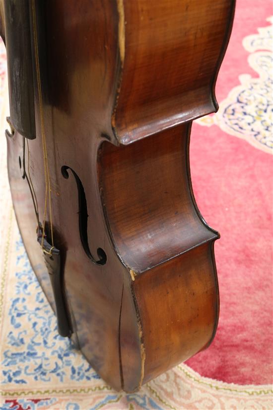 A full sized cello bearing label Arthur Richardson ... and two bows (one silver mounted), the other signed Wilhelm ... uhl